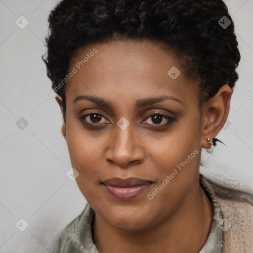 Joyful black young-adult female with short  brown hair and brown eyes