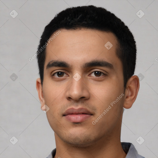 Neutral latino young-adult male with short  black hair and brown eyes