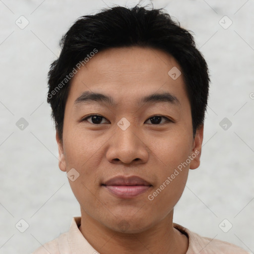 Joyful asian young-adult male with short  black hair and brown eyes