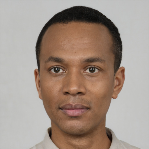 Neutral black young-adult male with short  black hair and brown eyes