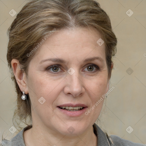 Joyful white adult female with medium  brown hair and grey eyes