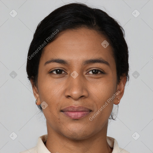 Joyful latino young-adult female with short  black hair and brown eyes