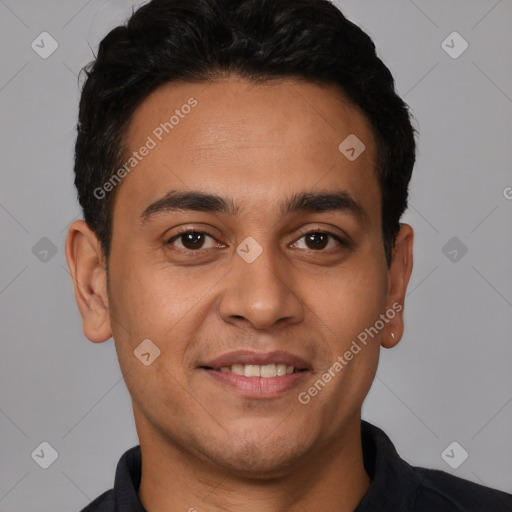 Joyful white young-adult male with short  black hair and brown eyes