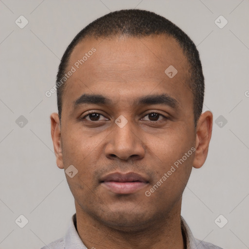 Neutral latino young-adult male with short  black hair and brown eyes