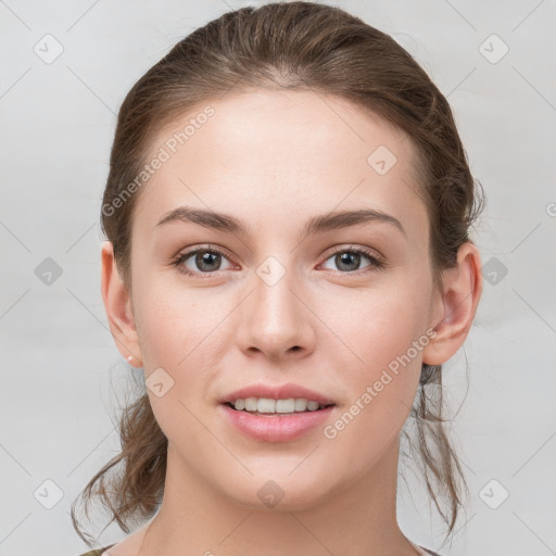 Joyful white young-adult female with medium  brown hair and grey eyes