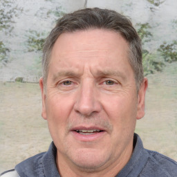 Joyful white middle-aged male with short  brown hair and brown eyes