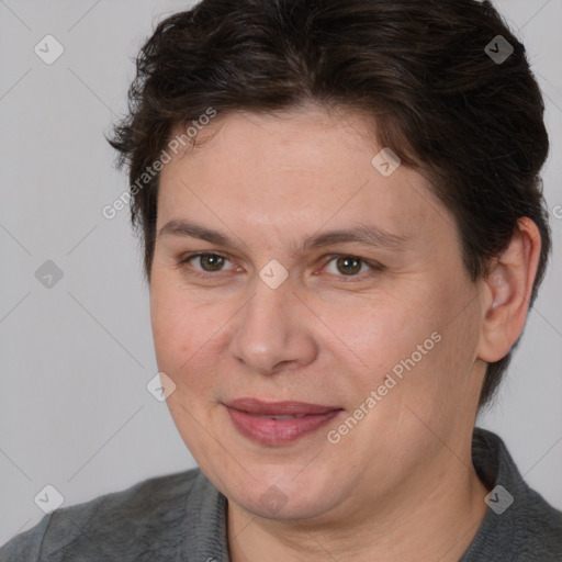 Joyful white adult female with short  brown hair and brown eyes