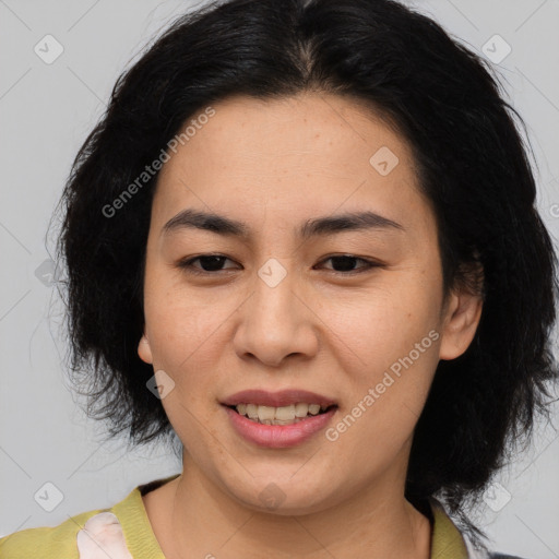 Joyful asian young-adult female with medium  black hair and brown eyes