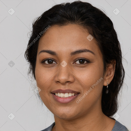 Joyful latino young-adult female with long  brown hair and brown eyes