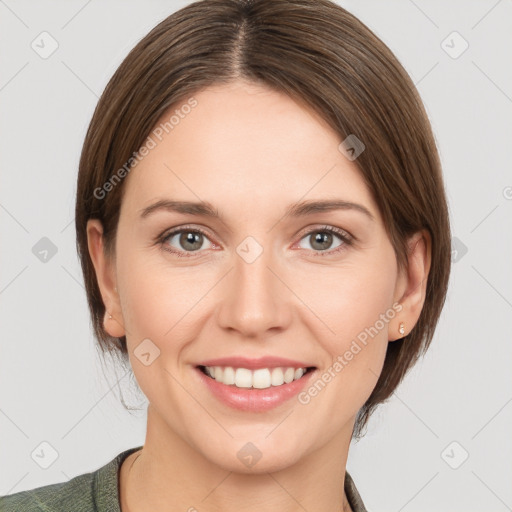 Joyful white young-adult female with medium  brown hair and grey eyes