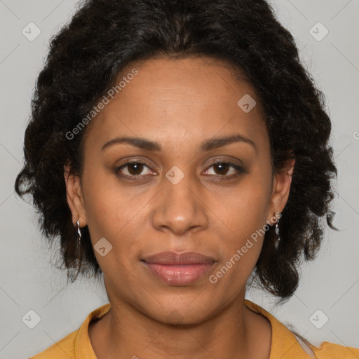 Joyful latino adult female with medium  brown hair and brown eyes