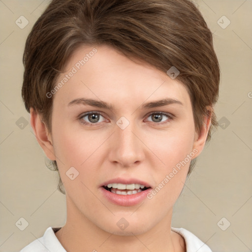 Joyful white young-adult female with short  brown hair and grey eyes