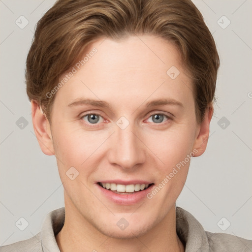 Joyful white young-adult female with short  brown hair and grey eyes