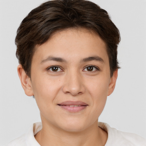 Joyful white young-adult female with short  brown hair and brown eyes
