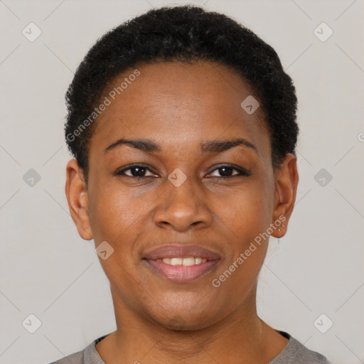 Joyful black young-adult female with short  black hair and brown eyes