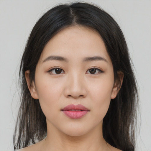 Joyful white young-adult female with medium  black hair and brown eyes