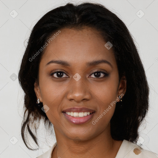 Joyful black young-adult female with medium  brown hair and brown eyes