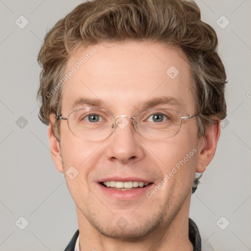 Joyful white adult male with short  brown hair and grey eyes