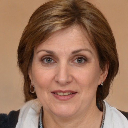 Joyful white adult female with medium  brown hair and brown eyes