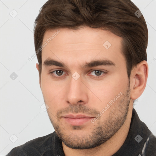 Neutral white young-adult male with short  brown hair and brown eyes