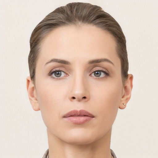 Neutral white young-adult female with short  brown hair and brown eyes