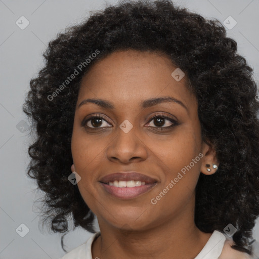 Joyful black young-adult female with long  brown hair and brown eyes