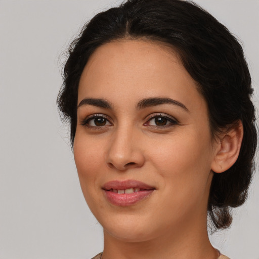 Joyful white young-adult female with medium  brown hair and brown eyes