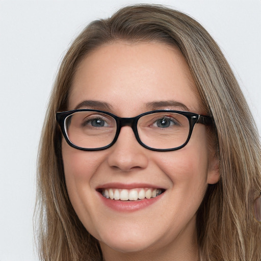 Joyful white young-adult female with long  brown hair and blue eyes