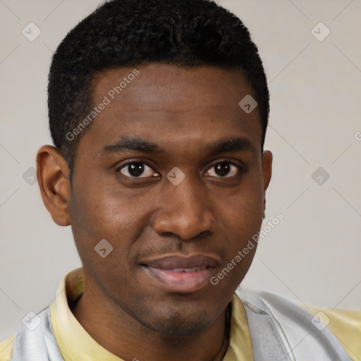 Joyful black young-adult male with short  brown hair and brown eyes