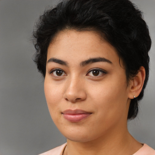 Joyful latino young-adult female with medium  black hair and brown eyes