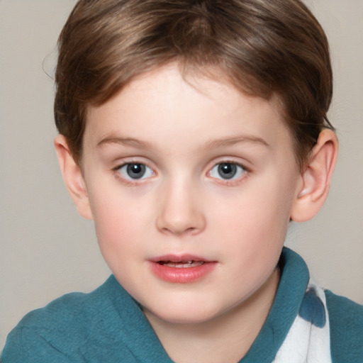 Joyful white child female with short  brown hair and blue eyes