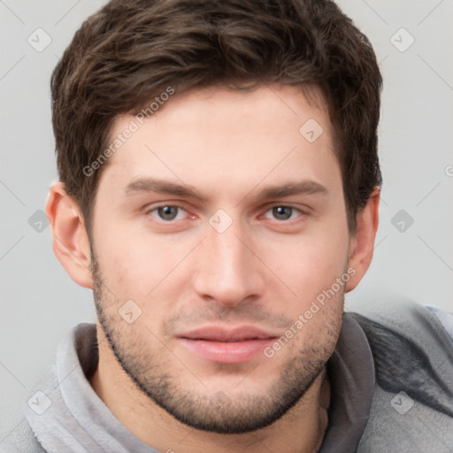 Neutral white young-adult male with short  brown hair and grey eyes