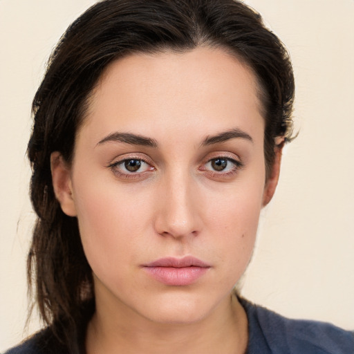 Neutral white young-adult female with long  brown hair and brown eyes