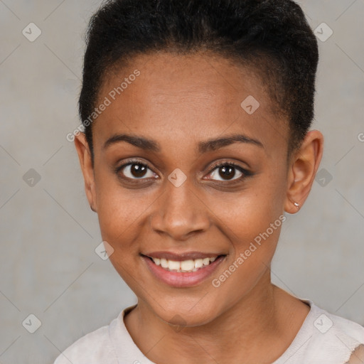 Joyful black young-adult female with short  brown hair and brown eyes