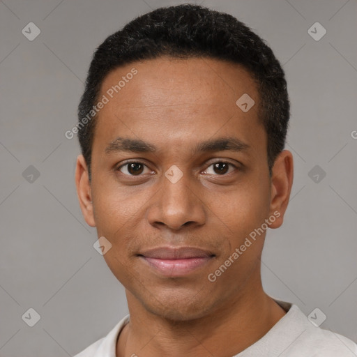 Joyful black young-adult male with short  black hair and brown eyes