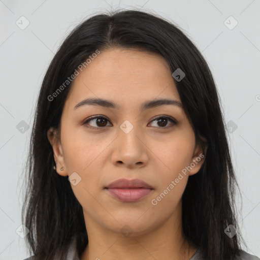 Joyful latino young-adult female with long  brown hair and brown eyes