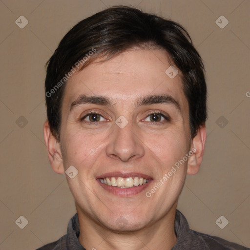 Joyful white adult male with short  brown hair and brown eyes