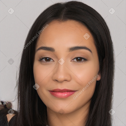 Joyful latino young-adult female with long  black hair and brown eyes