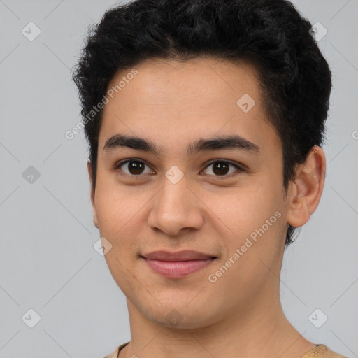 Joyful latino young-adult male with short  brown hair and brown eyes