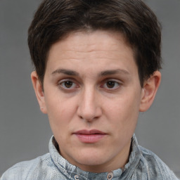 Joyful white adult female with short  brown hair and brown eyes