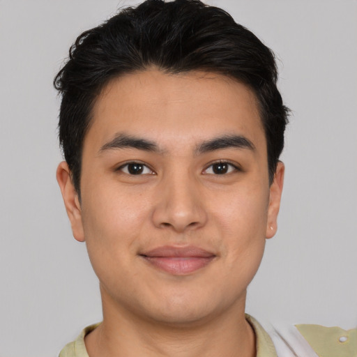 Joyful asian young-adult male with short  brown hair and brown eyes