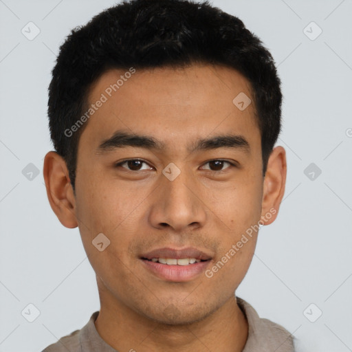 Joyful asian young-adult male with short  black hair and brown eyes