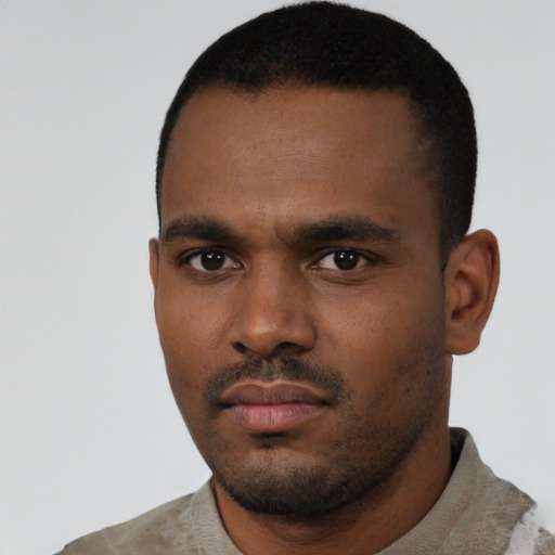 Neutral black young-adult male with short  black hair and brown eyes