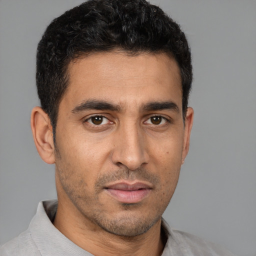 Neutral latino young-adult male with short  brown hair and brown eyes