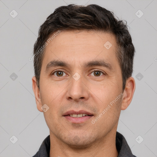 Joyful white adult male with short  brown hair and brown eyes