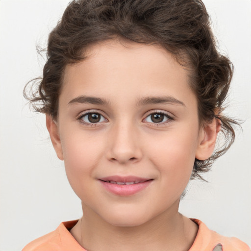 Joyful white child female with medium  brown hair and brown eyes