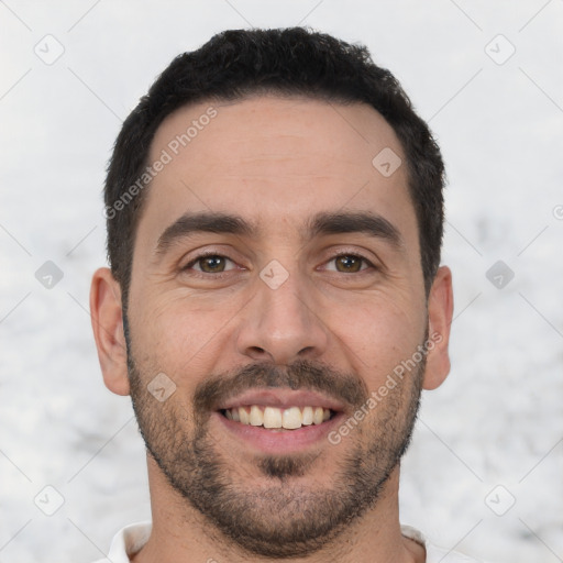 Joyful white young-adult male with short  black hair and brown eyes