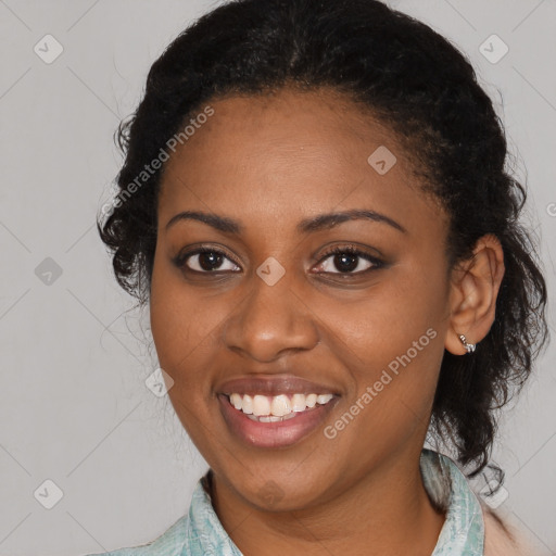 Joyful black young-adult female with medium  black hair and brown eyes