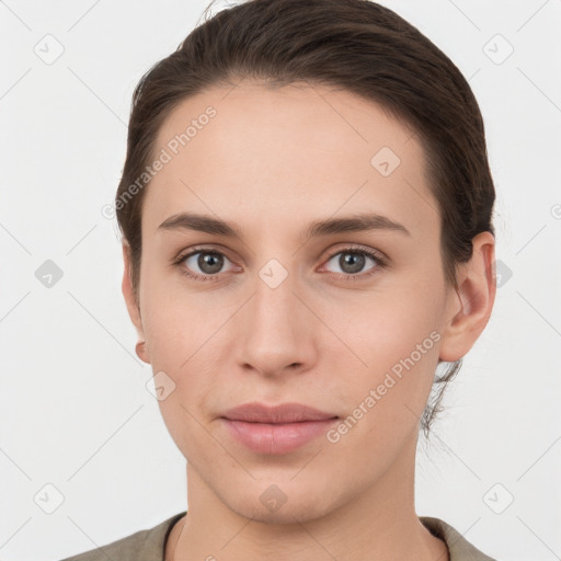 Neutral white young-adult female with short  brown hair and brown eyes