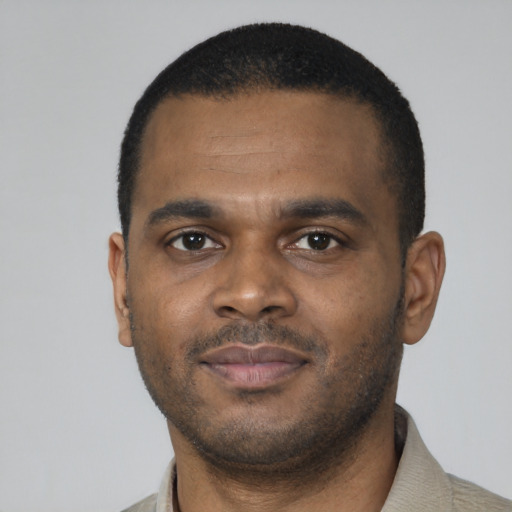 Neutral black young-adult male with short  black hair and brown eyes